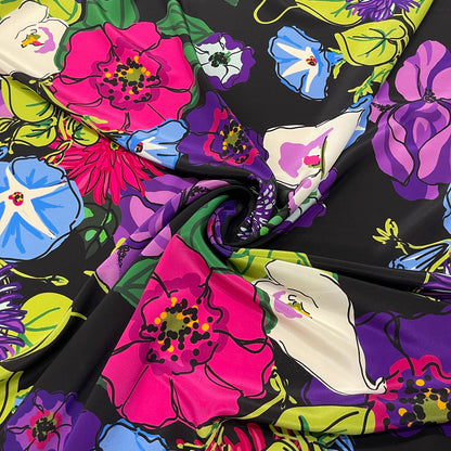 Crêpe de Chine in pura seta con grandi fiori multicolore su fondo nero
