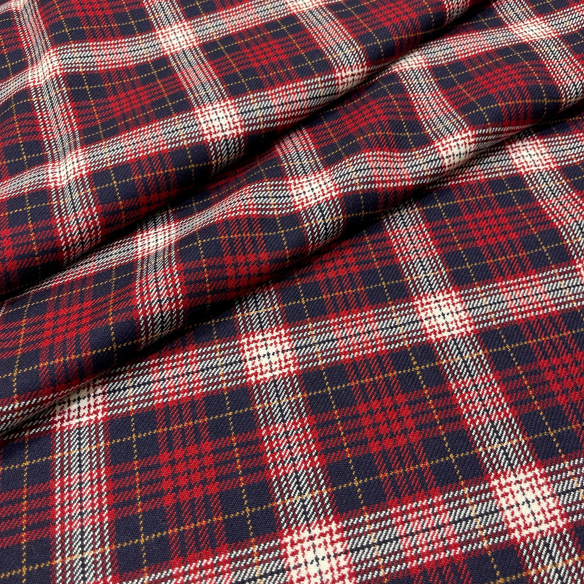 Tartan in pura lana vergine con quadri blu, rossi e panna e sottili righe ocra, dettaglio del tessuto