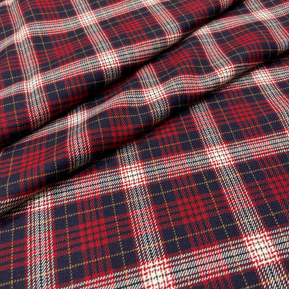 Tartan in pura lana vergine con quadri blu, rossi e panna e sottili righe ocra, dettaglio del tessuto